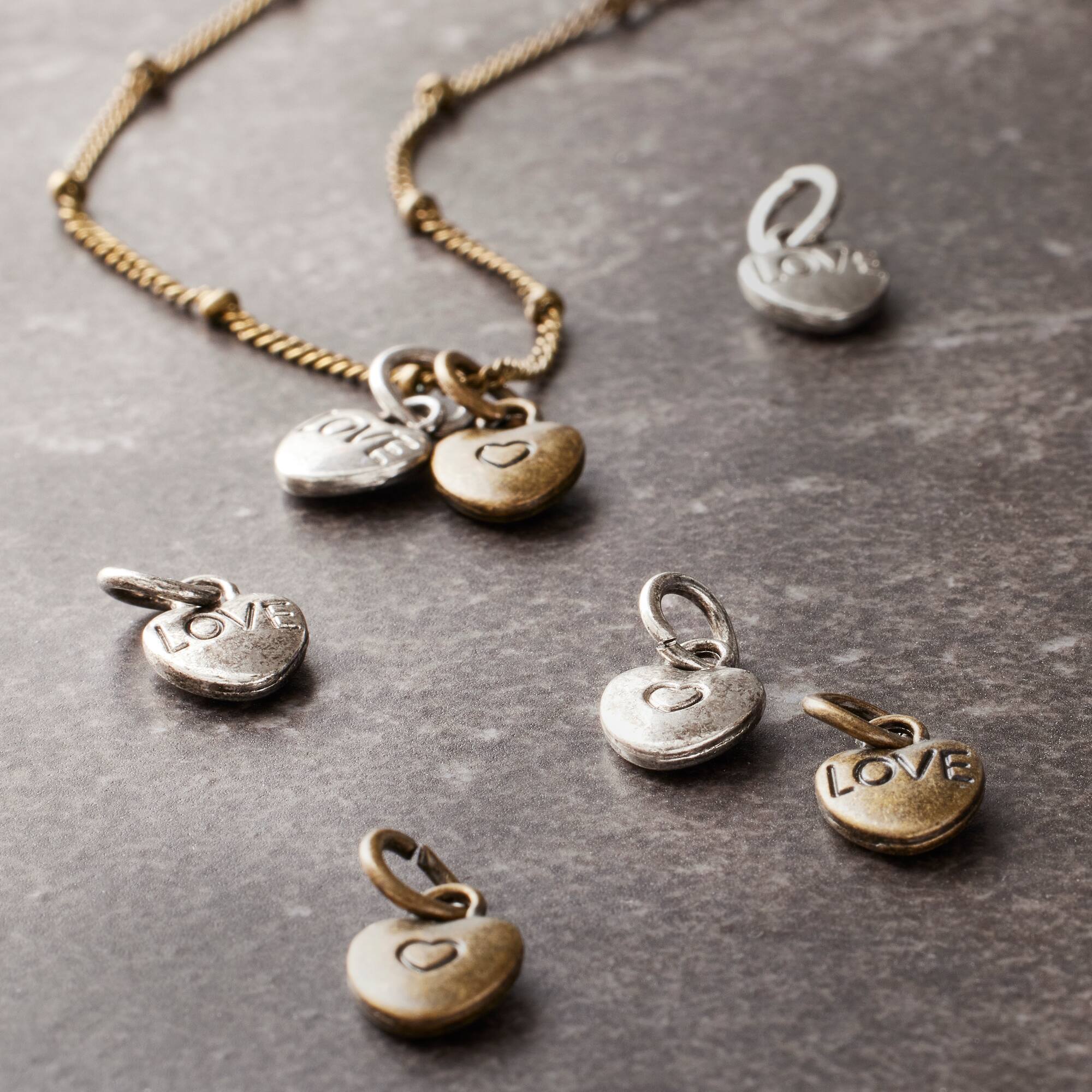 12 Packs: 25 ct. (300 total) Metal Heart-Shaped Charms by Bead Landing™